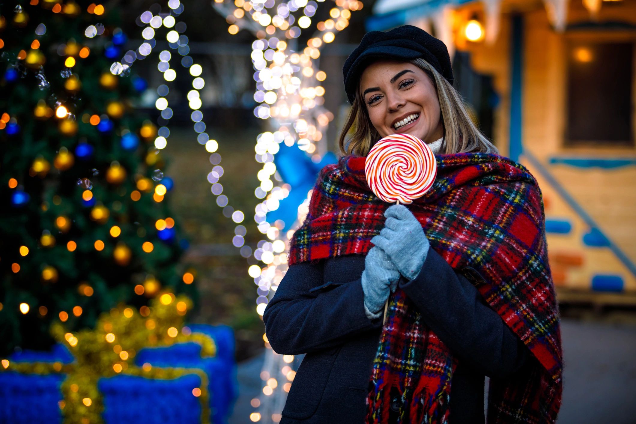 Person holding candy lollipop