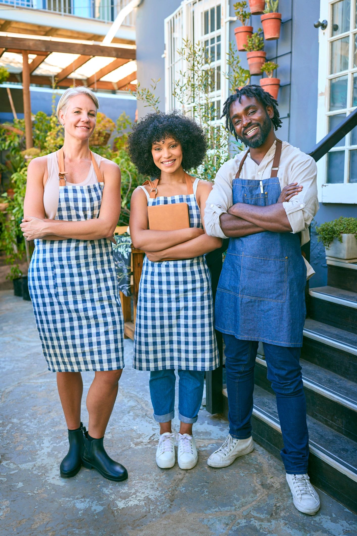 Smiling candy shop team portrait