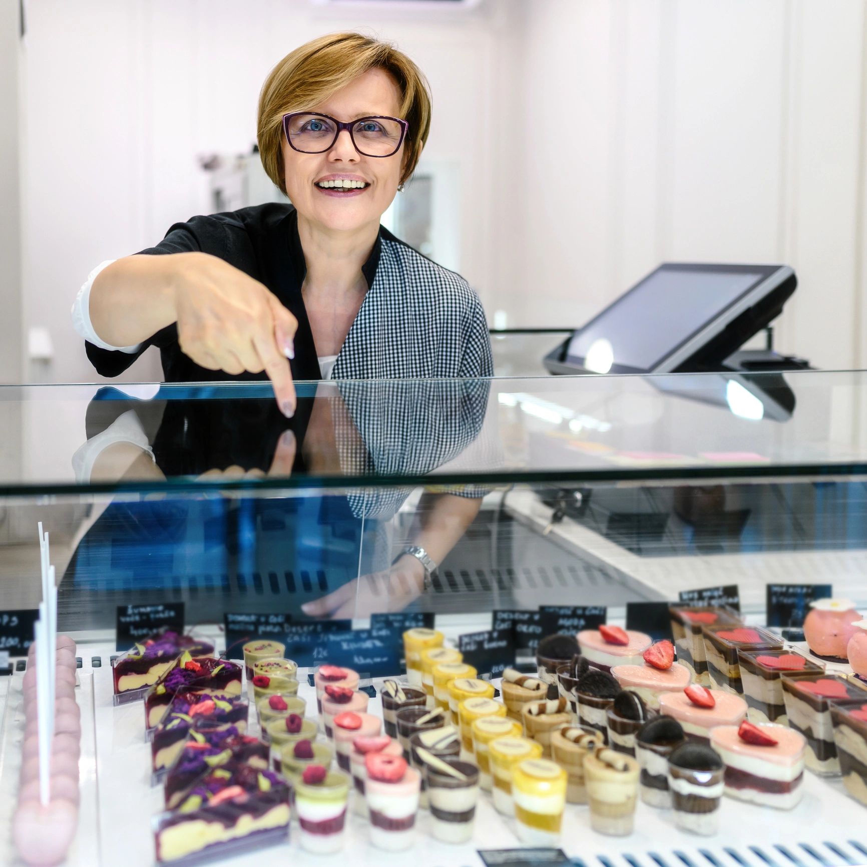 Portrait of confectioner in pastry shop