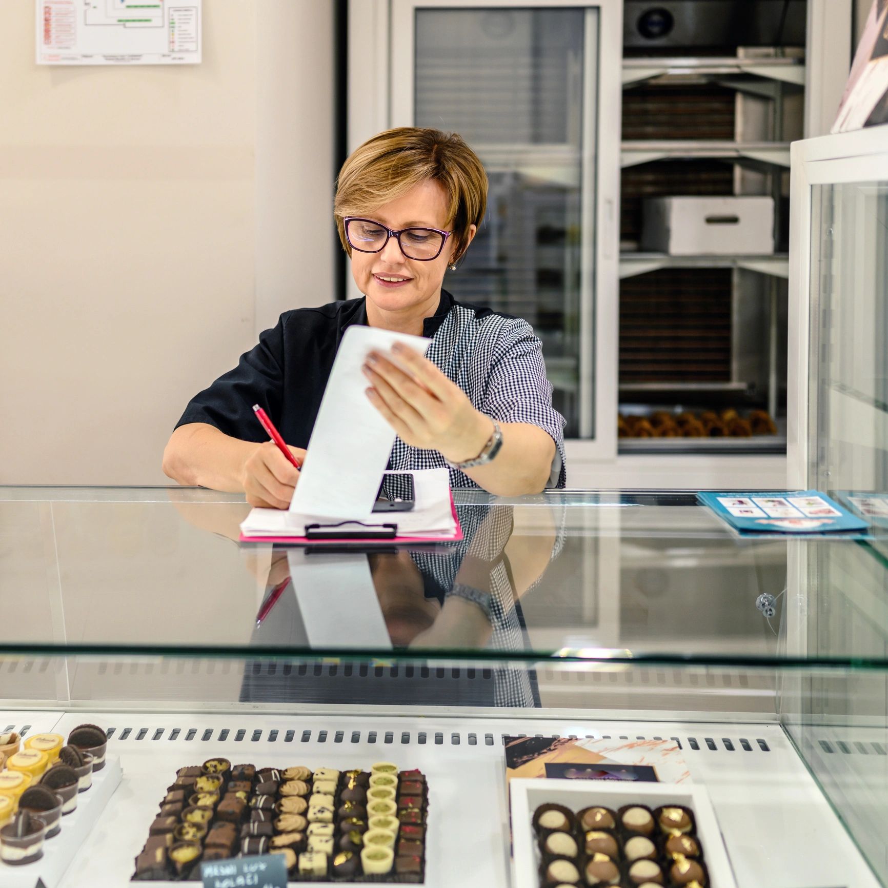 Portrait of confectioner in pastry shop